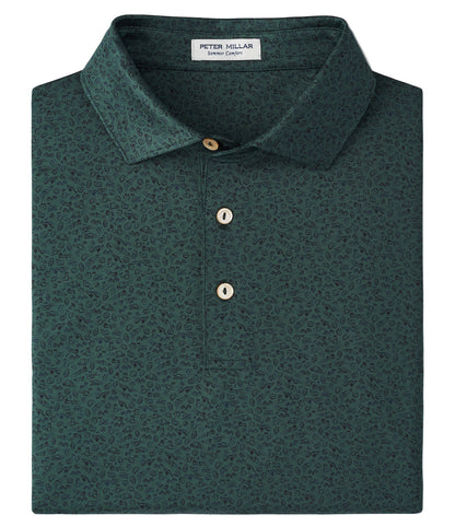 The Peter Millar No Slow Play Performance Jersey Polo is a dark green, short-sleeve polo with a subtle pattern, three buttons, and an inside collar label, crafted for four-way stretch and UPF 50+ protection.