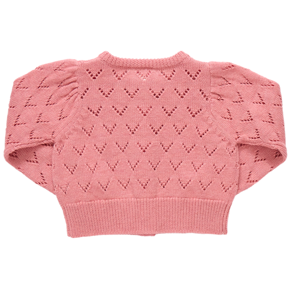 The Girls' Connie Sweater by Pink Chicken is a pink knitted cardigan with puffed sleeves and a heart-shaped pointelle pattern, shown laid flat with the back side up for extra charm.