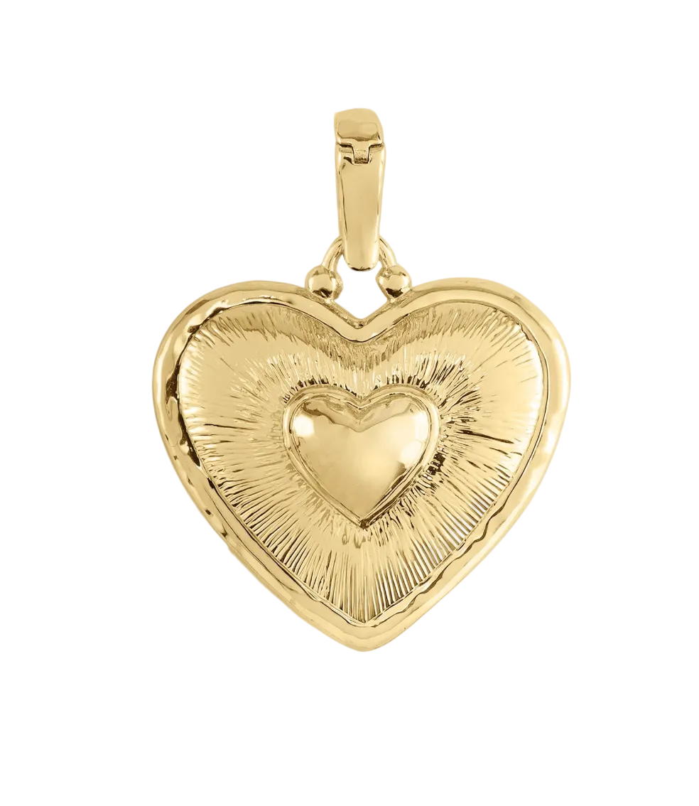 Anabel Aram Heart Radiant Charm: a gold heart-shaped sacred heart charm with a central raised heart and etched sunburst detailing.