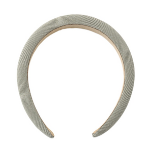 The Girls’ Padded Headband by Rylee & Cru features a light gray color and a wide, curved, padded design for both comfort and style—making it the ideal accessory for everyday wear. Shown on a plain white background.