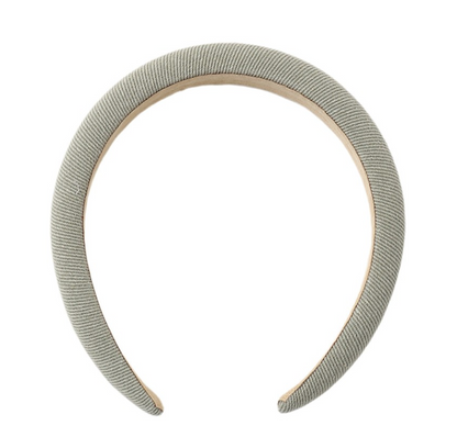 The Girls’ Padded Headband by Rylee & Cru features a light gray color and a wide, curved, padded design for both comfort and style—making it the ideal accessory for everyday wear. Shown on a plain white background.