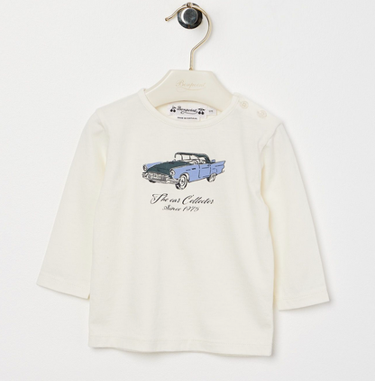 The Bonpoint Baby Boys' and Boys' Tahsin T-shirt, made from organic cotton, features a playful dog print on the front and is displayed hanging on a hanger.