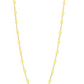 The Gigi Clozeau Classic Gigi Necklace 16.5", crafted by Gigi Clozeau from 18 carat yellow gold, showcases striking jewels and small yellow beads evenly spaced along its length against a white background.