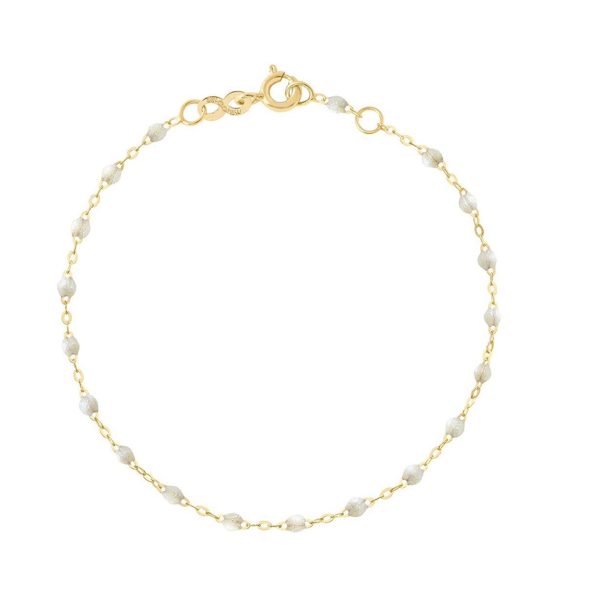 The Gigi Clozeau Classic Gigi Bracelet 6.7" by Gigi Clozeau is a stunning piece crafted with 18 carat Yellow Gold, featuring a gold chain adorned with small white beads and a secure clasp.