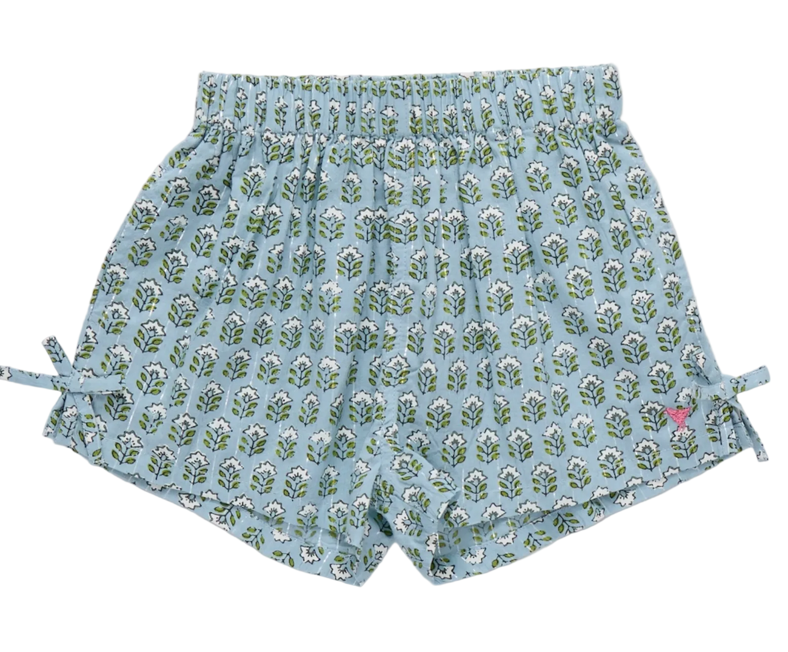 The Girls’ Jules Short by Pink Chicken showcases a Blue Prairie Blockprint adorned with a charming green and white leaf pattern, featuring an elastic waist for extra comfort, adorable side bows, and a small pink butterfly logo near the bottom hem.
