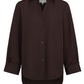 The TWP Next Morning Shirt is a dark brown Italian cotton button-up with long sleeves, a collar, chest pocket, and cuffed sleeves in a relaxed fit, shown on a plain white background.