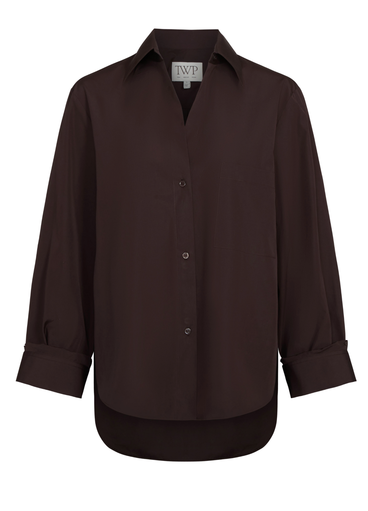 The TWP Next Morning Shirt is a dark brown Italian cotton button-up with long sleeves, a collar, chest pocket, and cuffed sleeves in a relaxed fit, shown on a plain white background.