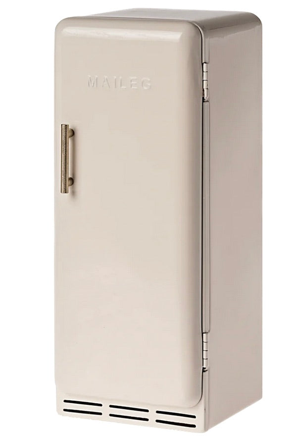A small, beige Miniature Fridge by Maileg, featuring a vintage-inspired design with a vertical handle and the brand name embossed on the door.