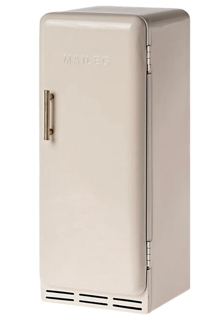 A small, beige Miniature Fridge by Maileg, featuring a vintage-inspired design with a vertical handle and the brand name embossed on the door.