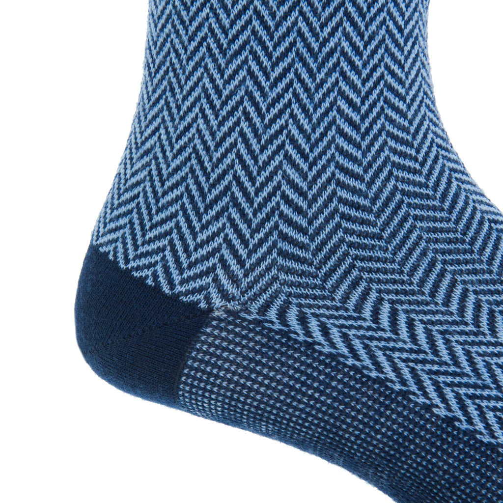 Close-up of the Dapper Classics Dress Navy and Sky Blue Herringbone Fine Merino Wool Sock, showcasing a herringbone pattern and solid toe—ideal for patterned sock enthusiasts.