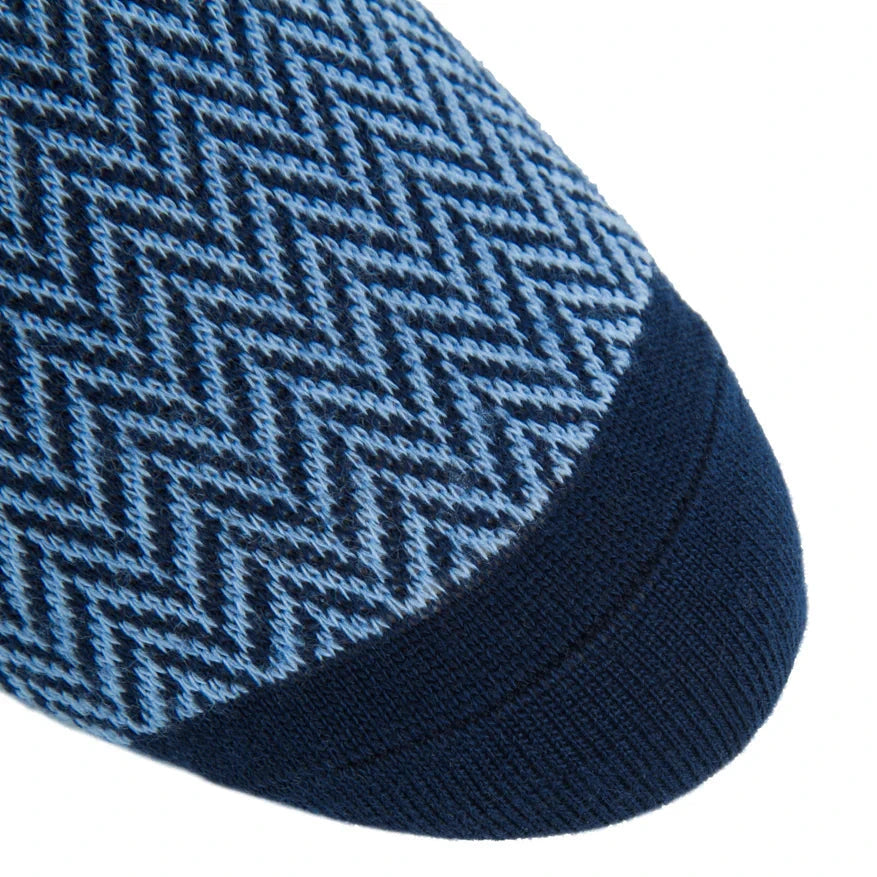 Close-up of the toe area of Dapper Classics' Dress Navy and Sky Blue Herringbone Fine Merino Wool Mid-Calf Sock, featuring a chevron pattern in light and dark blue with a solid navy toe cap.