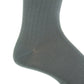 Close-up of the Dapper Classics Steel Gray Solid Ribbed Cotton Sock with a linked toe, shown worn on a foot at mid-calf height, highlighting the ankle and heel against a white background.