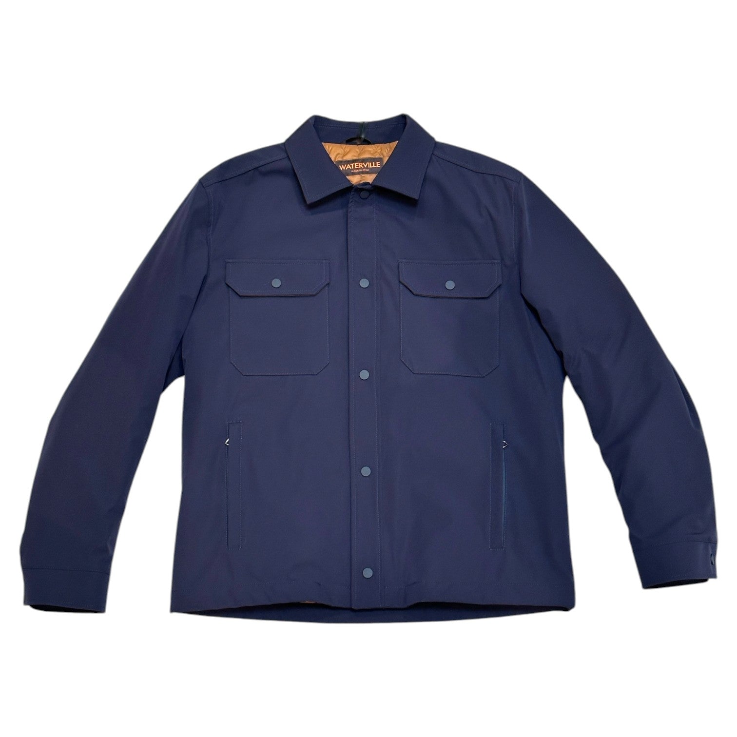 The Waterville Nylon Shirt Jacket in navy blue features a collar, two flap chest pockets, and two vertical side pockets for lightweight durability and style, shown on a white background.