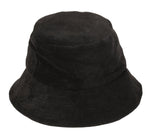 The Lack of Color Wave Terry Bucket Hat from the renowned brand Lack of Color is a black, cotton terry cloth bucket hat with a wide brim and soft material, offering UPF Rating 50+ for excellent sun protection.