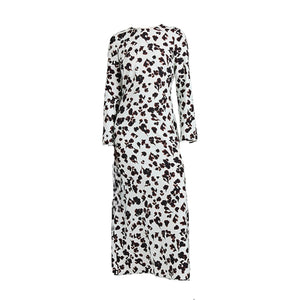 The Proenza Schouler White Label Waverly Dress is an ankle-length, long-sleeve dress with a white base and abstract black and brown floral print.