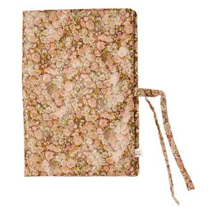 The Bonpoint Ebba Health Record Cover, crafted from Liberty Fabrics with a pink and green floral pattern and tie closures, is shown against a white background—ideal for keeping your baby’s documents organized.