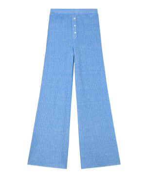 The Rib Everywear Pant by Guest in Residence is a light blue women's knit pant featuring a ribbed texture, high waist, and button fly, displayed flat on a white background.