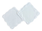Two plush Terry Tots Wash Cloths with scalloped edges are laid flat and slightly overlapping on a white background, perfect for gentle cleansing.