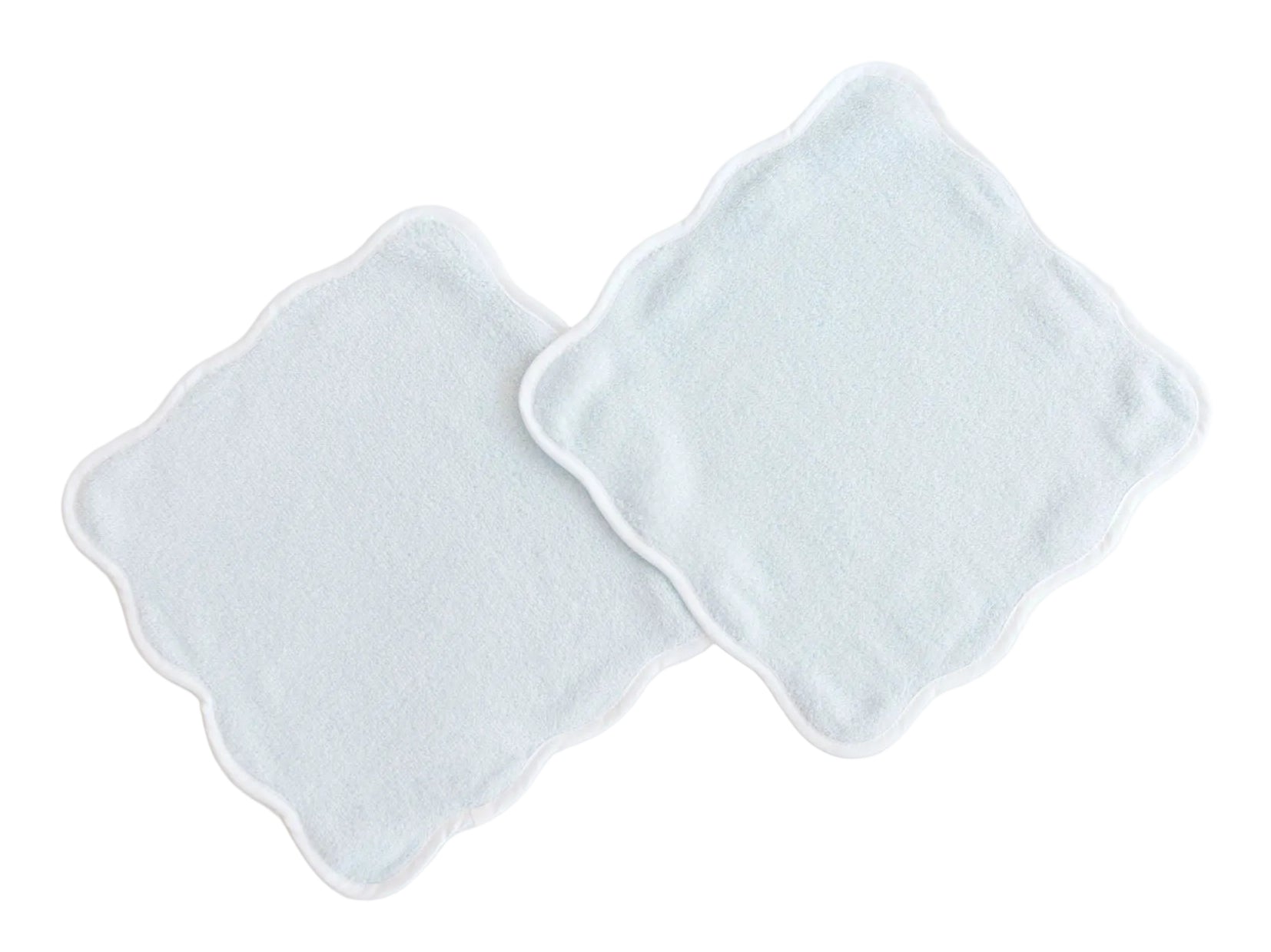 Two plush Terry Tots Wash Cloths with scalloped edges are laid flat and slightly overlapping on a white background, perfect for gentle cleansing.