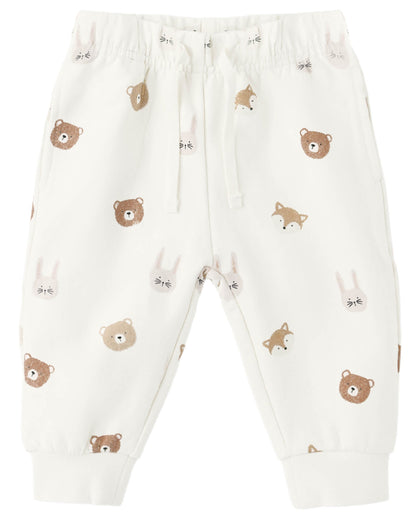 The Quincy Mae Baby Boys’ and Boys’ Relaxed Fleece Sweatpant features an elastic waist and cuffs, plus an all-over print of brown bears, beige foxes, and white bunny faces on soft white fleece—making these cozy sweatpants perfect for everyday wear.