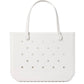 A white, rectangular Original Bogg® Bag tote from Bogg Bags features two handles and evenly spaced holes on the front. The brand name “bogg” is embossed on the lower right corner, making this washable bag a practical choice for your next beach tote.