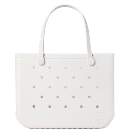 A white, rectangular Original Bogg® Bag tote from Bogg Bags features two handles and evenly spaced holes on the front. The brand name “bogg” is embossed on the lower right corner, making this washable bag a practical choice for your next beach tote.