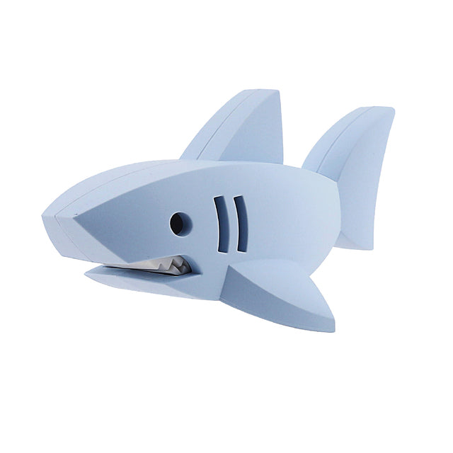 A toy shark from the Halftoys Ocean Friends collection features angled fins and an open mouth displaying teeth. This creation by Halftoys has a simple, geometric design.