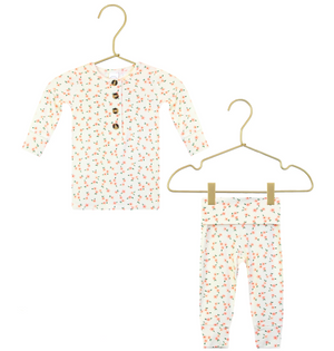 Dress your little one in cozy comfort with the Lou Lou & Company Baby Girls’ and Girls’ Lottie Top & Bottoms. This adorable two-piece set features a long-sleeve, buttoned shirt and matching pants, both crafted from silky-soft fabric in white adorned with a charming small colorful floral print. Displayed on gold hangers, this outfit ensures all-day coziness and style.