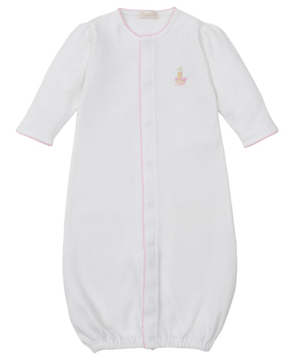 The Kissy Kissy Baby Premier Noah's Ark Convertible Gown with Hand Emb. is a white, long-sleeved Peruvian cotton gown with pink trim, elastic hem, and a small Noah's Ark embroidery on the left chest.