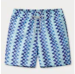 The Staniel Swim Trunk by Love Brand is made from quick-dry recycled fabric in light blue, featuring a purple geometric pattern and a drawstring waistband for comfort.