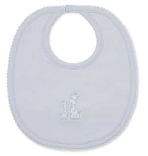 The Giraffe Laughs Bib by Kissy Kissy is a light blue baby mealtime bib made from super-soft Pima cotton, featuring scalloped edges and an embroidered design of two giraffes in the center.