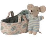 The Maileg Baby Mouse in Carry Cot - Blue features a tiny baby mouse dressed in a blue and white striped outfit, nestled inside a soft, floral-patterned fabric basket with handles—perfect as an adorable travel cradle or carry cot for imaginative playtime adventures.
