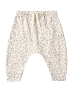 Quincy Mae’s Baby and Kids’ Drawstring Pant features a small purple floral print on soft organic brushed jersey, designed with an elastic waistband and drawstring for easy pull-on comfort.