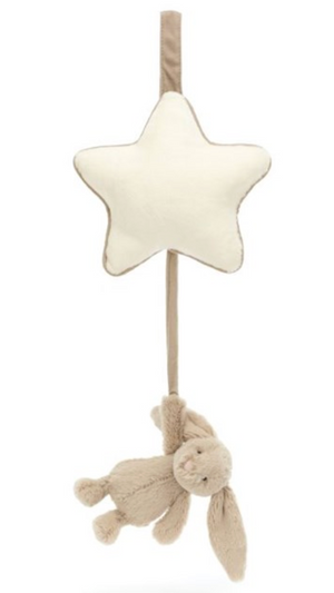 A Jellycat Bashful Beige Bunny Musical Pull features a cream-colored star at the top and a light brown Bashful Silver Bunny hanging below on a beige strap.