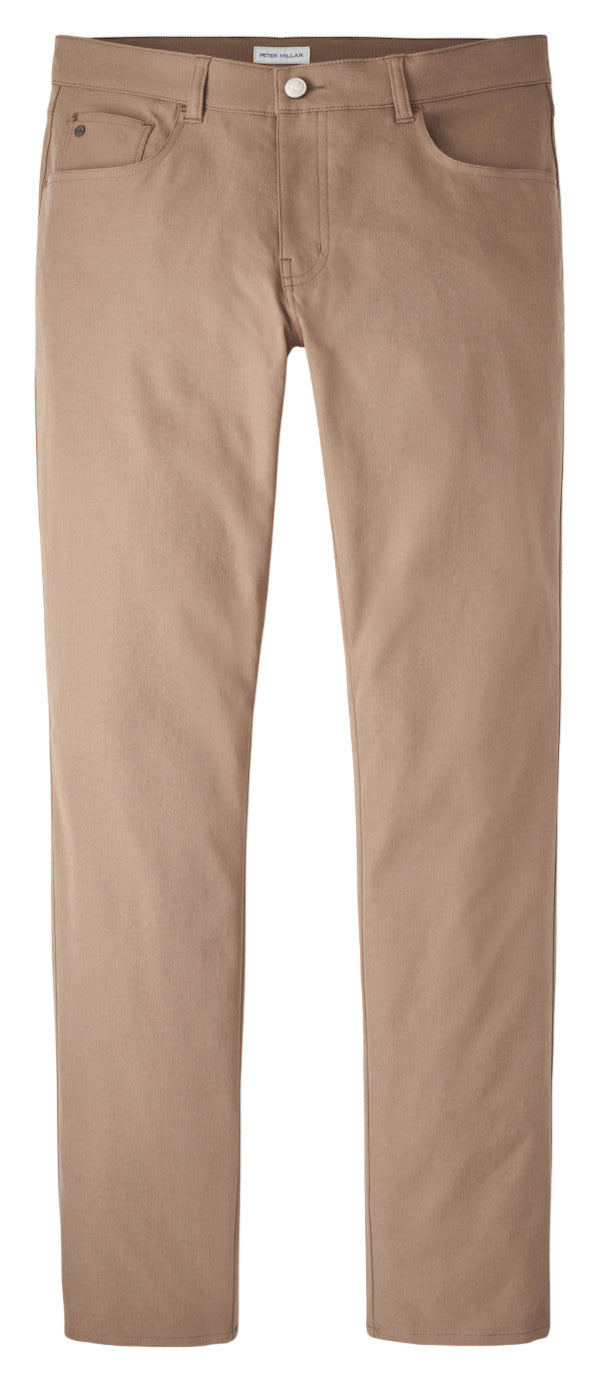 The Peter Millar eb66 Performance Five-Pocket Pant features tan straight-leg jeans made from stretch twill with a comfort waistband, shown against a white background.
