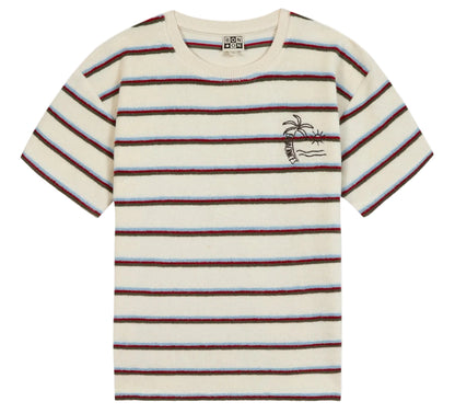 The Boys’ Livo T-Shirt by Bonton is a short-sleeved cream cotton tee for kids, featuring horizontal red, black, and blue stripes plus a small embroidered palm tree and waves on the left chest—perfect for everyday adventures.