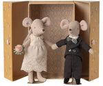 The Maileg Wedding Mice Couple in Box, Mum and Dad, features a charming mouse bride and groom dressed in wedding attire, standing inside an open, patterned box with decorative wallpaper—making it a delightful wedding gift.