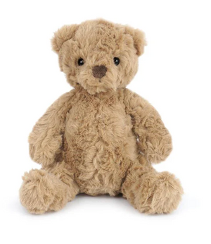A soft, light brown Huggie Bear by Mon Ami sits upright against a plain white background, its black eyes and ultra soft plush texture making it the perfect children’s stuffed animal.