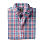 A neatly folded Faherty Movement Monterey Shirt with a blue, red, and white plaid pattern, featuring a collar and chest pocket. This lightweight, comfortable shirt is also wrinkle resistant—perfect for everyday wear.