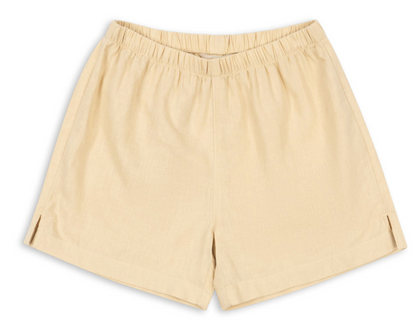 Introducing the Konges Slojd Baby Boys’ and Boys’ Franzen Linen Shorts, crafted from a comfortable linen blend in a beige hue. These knee-length shorts feature an elastic waistband and subtle side slits at the hem, shown laid flat on a white background.
