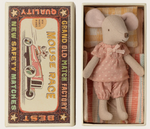 The Maileg Big Sister Mouse in Matchbox wears soft pink pajamas and rests comfortably inside her matchbox bed, complete with a striped pillow and blanket. The vintage-style box lid is decorated with charming racing graphics and the words "Mouse Race" and "BEST QUALITY.