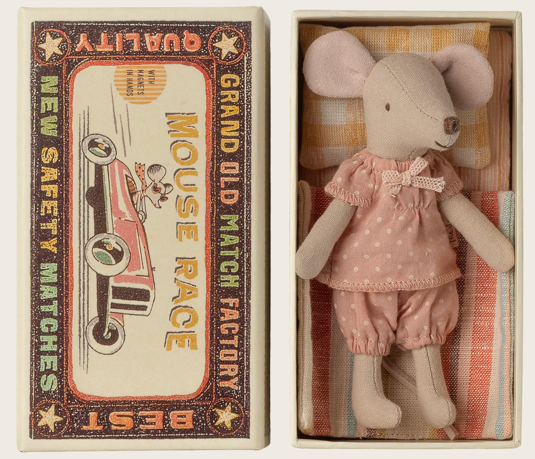 The Maileg Big Sister Mouse in Matchbox wears soft pink pajamas and rests comfortably inside her matchbox bed, complete with a striped pillow and blanket. The vintage-style box lid is decorated with charming racing graphics and the words "Mouse Race" and "BEST QUALITY.