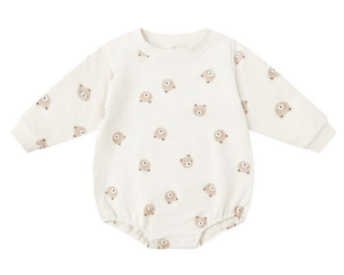 The Quincy Mae Baby Crewneck Bubble Romper features cream-colored French terry, long sleeves, and a cute cartoon bear face pattern—ideal for your baby's transitional wardrobe.