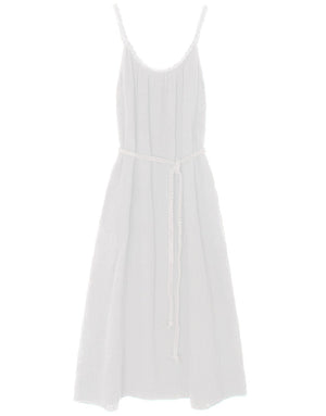 The Braiden Dress by Xirena is a white flowy tank midi dress with thin straps, a gathered neckline, and a braided waist belt, shown on a plain background.