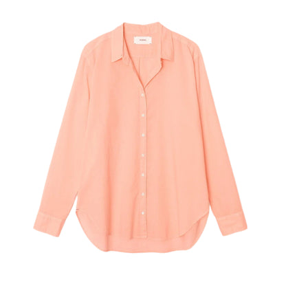 The Xirena Beau Shirt by Xirena is a long-sleeve, light peach cotton poplin shirt with a collar and button-up front, displayed against a white background.