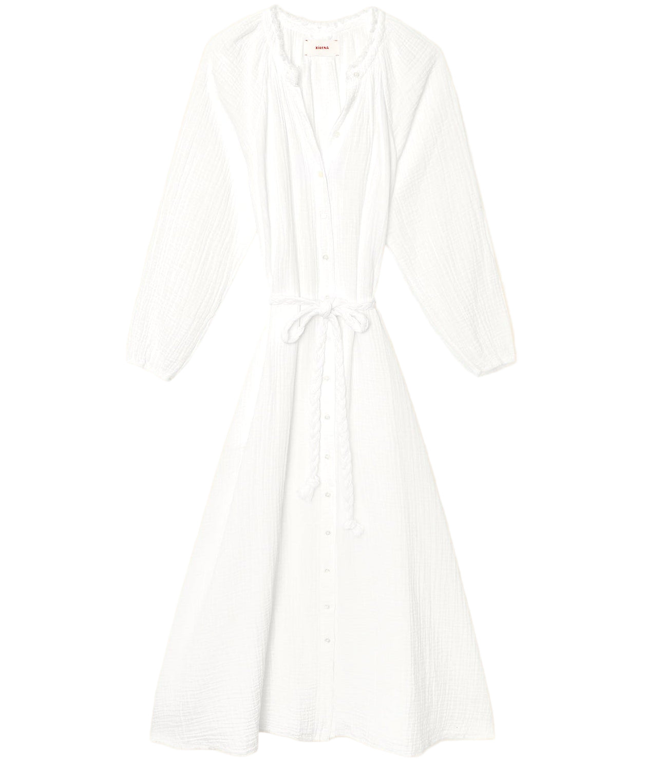 The Andrea Dress by Xirena is a white, long-sleeve, button-down midi dress featuring a cinched waist tie and soft textured cotton gauze fabric, shown laid flat on a white background.