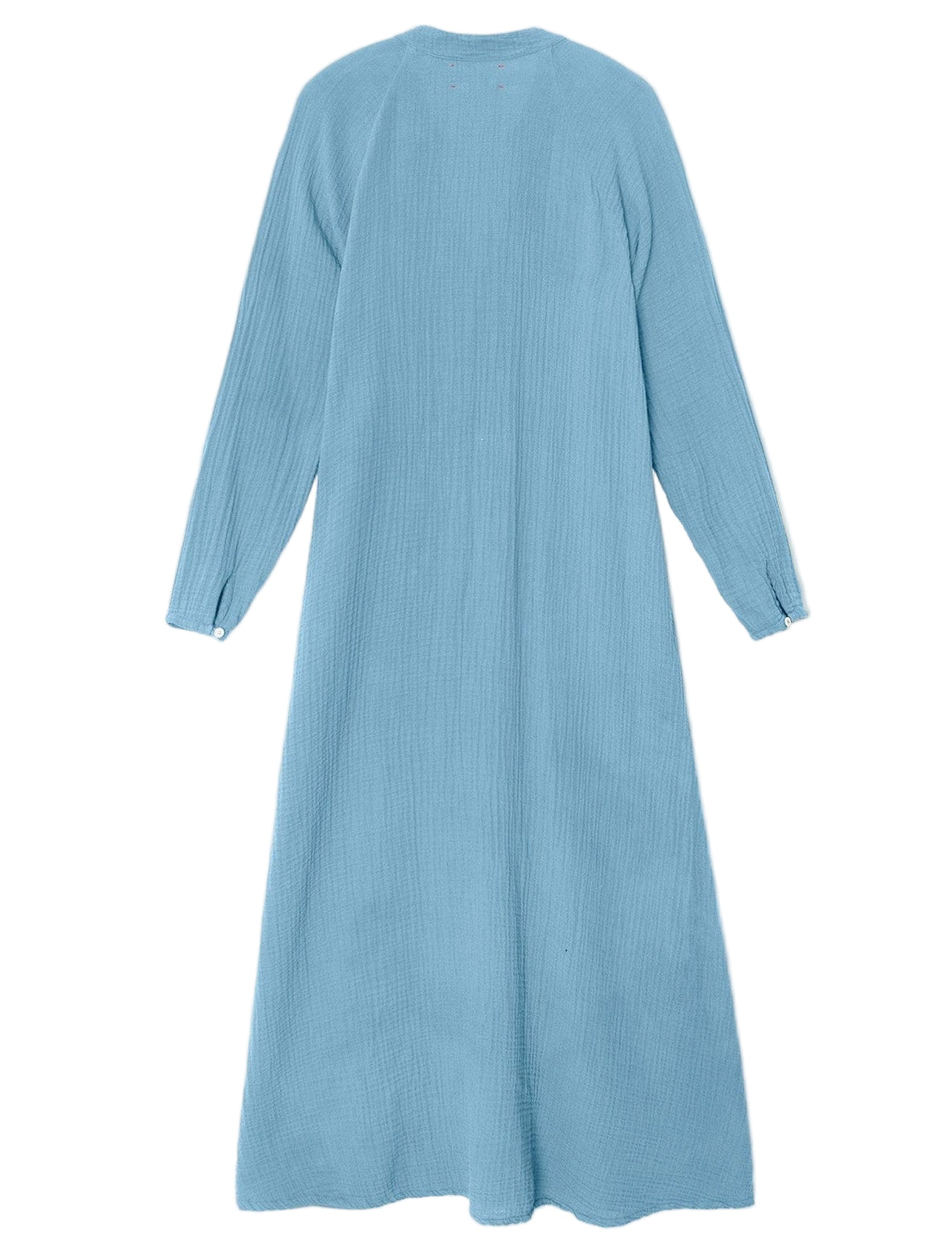 The Tabitha Dress by Xirena is a light blue cotton gauze midi with long sleeves and ankle length, shown flat from the back against a white background.