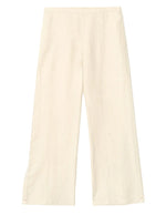 The Xirena Pippen Linen Pant features a wide-leg, high-waisted silhouette and an elasticized waist, shown here in cream linen laid flat on a white background.