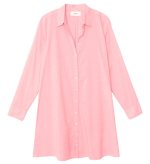 The Xirena Bobby Dress is a long-sleeve, button-down cotton poplin shirt dress in light pink with a collar, shown on a white background.