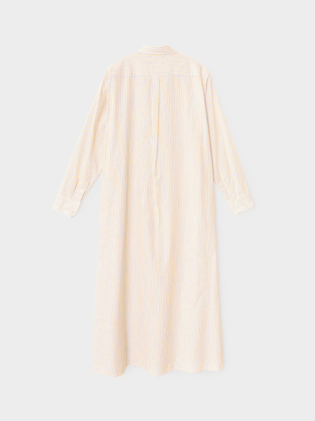 The Xirena Boden Stripe Dress is a long-sleeved, ankle-length shirtdress in pastel vertical stripes, made from lightweight cotton and shown from the back on a plain white background.